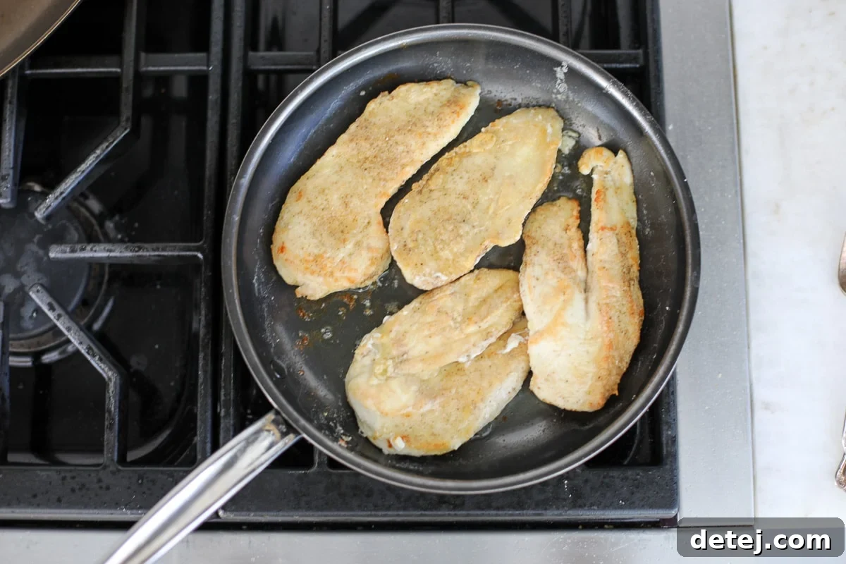 sautéed chicken in a pan.