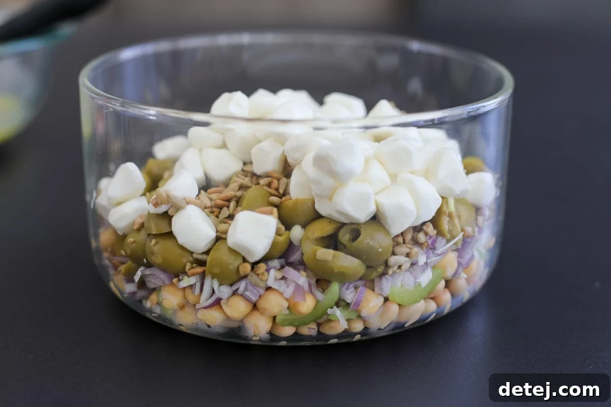 Vibrant Green Olive and Celery Bean Salad 5 Fresh ingredients layered in a bowl, awaiting the dressing.