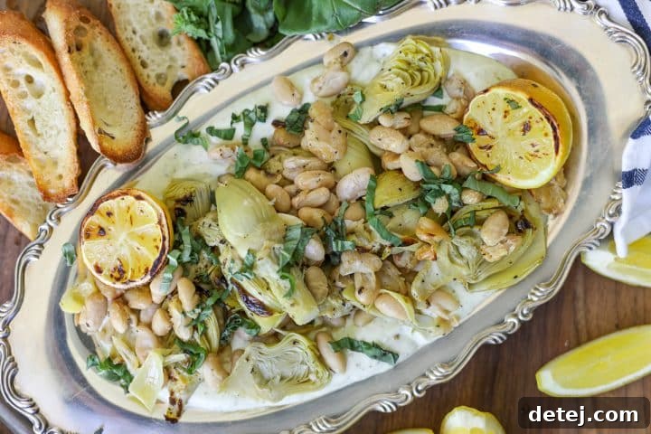 Finished Roasted Artichokes and Beans over Whipped Pesto Ricotta appetizer.