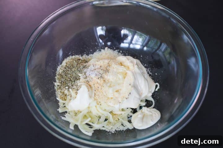 A bowl containing the mixed cheese blend for the dip.