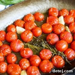 tomato confit in a roasting pan.