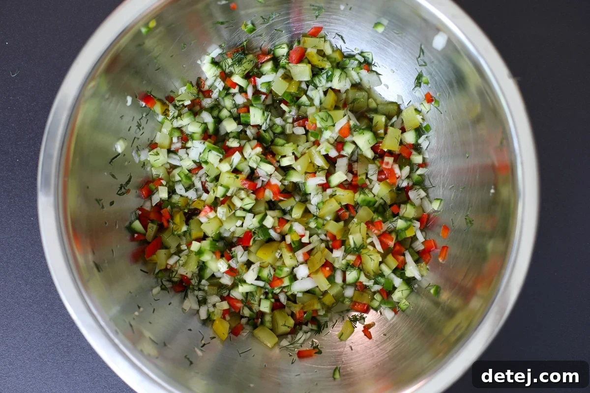 Dill-icious Salsa 4 A large mixing bowl filled with freshly prepared pickle de gallo, ready to serve.