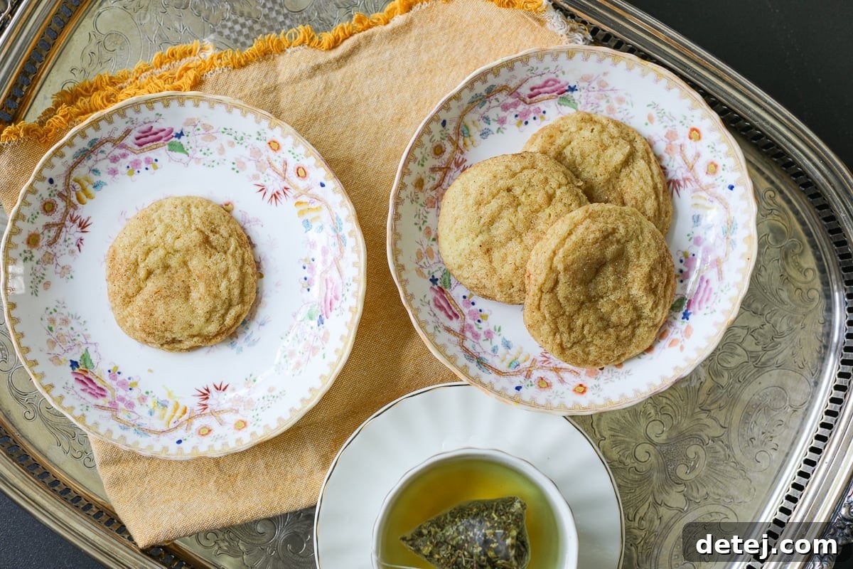 Freshly baked orange spiced cookies cooling on a wire rack.