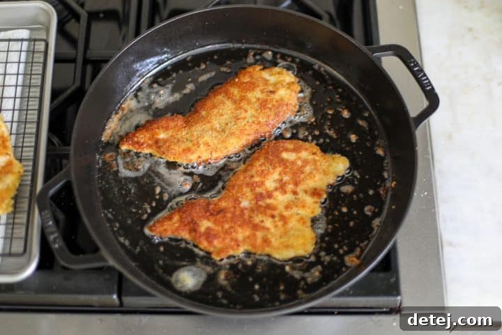 Agile Chicken Cutlets 7 Crispy chicken cutlets shallow frying to a golden brown on both sides.
