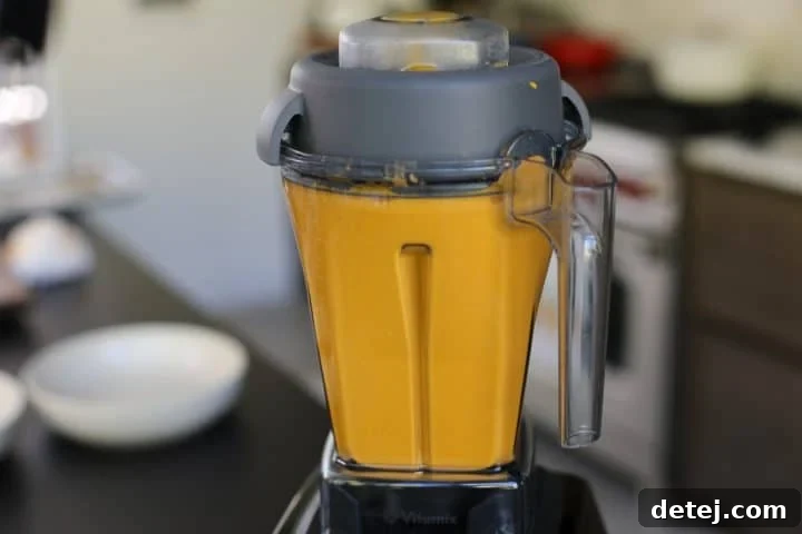 creamy soup blending in a blender.