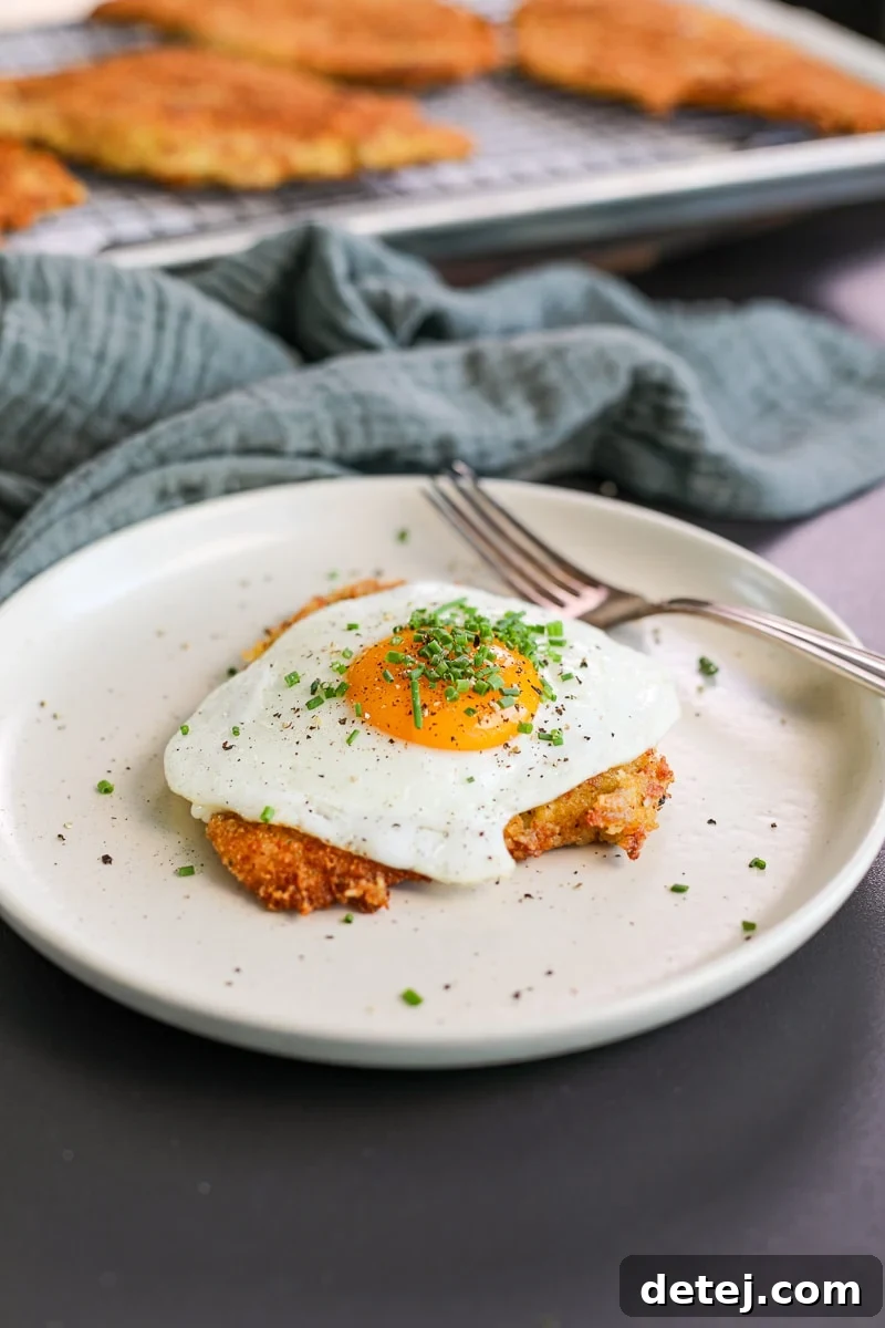 Ultimate Breakfast Chicken Cutlets 2 bacon egg and cheese chicken cutlets on a plate, ready to be enjoyed as a gourmet breakfast.