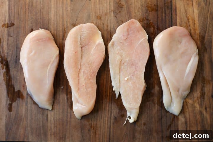Ultimate Breakfast Chicken Cutlets 8 butterflied chicken cutlets laid out, ready for pounding and seasoning.