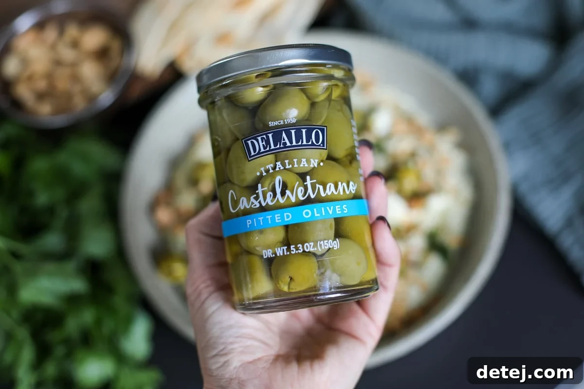 A jar of Delallo Castelvetrano olives, the key ingredient for the appetizer's olive component.