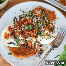 Burrata Bruschetta Chicken Cutlets on a serving platter, garnished and ready to eat.