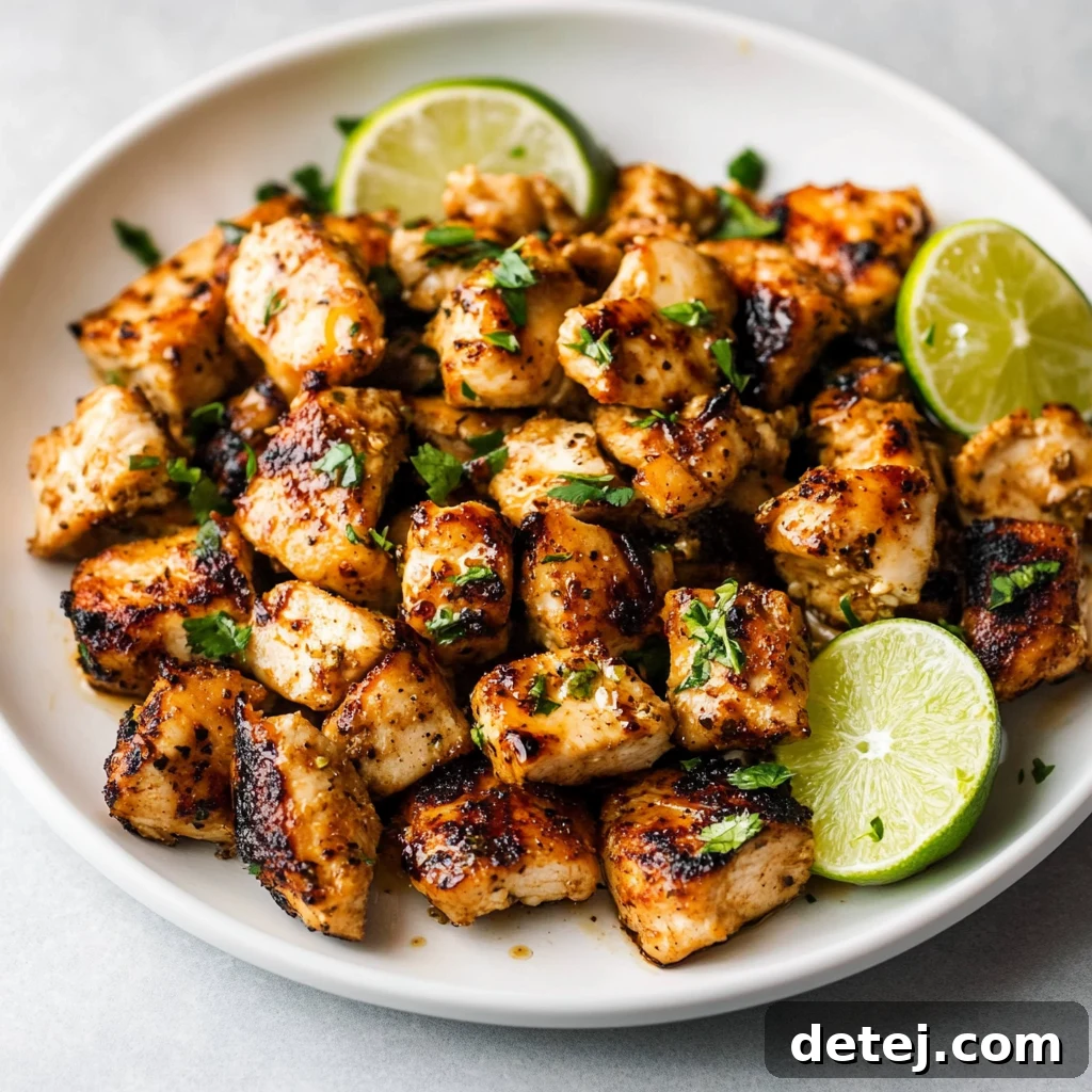 Grilled honey lime chicken, perfectly seared with beautiful char marks, ready for slicing.