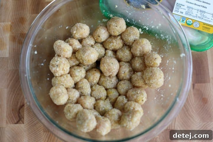 Mini meatballs rolled out and ready to be pan-fried.