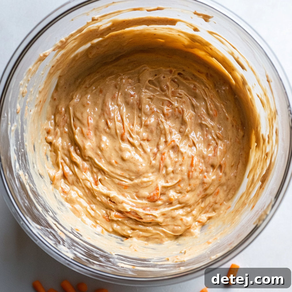 Sweet Carrot Spice, Cream Cheese Cloud 3 Carrot cake batter in a bowl, ready to be poured into pans