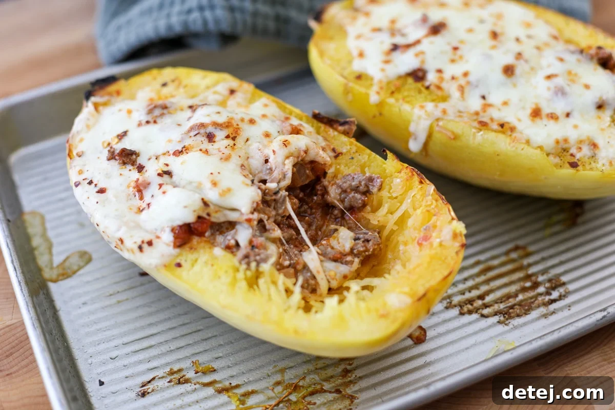Two beef and protein boats stuffed with creamy beef and cheese, ready to be served.