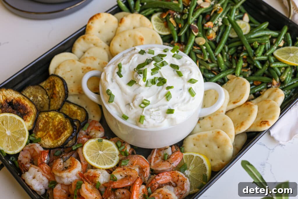 Refreshing Tzatziki Spread 3 Close-up of Tzatziki Snack Board with dip, green beans, and shrimp – Healthyish Foods