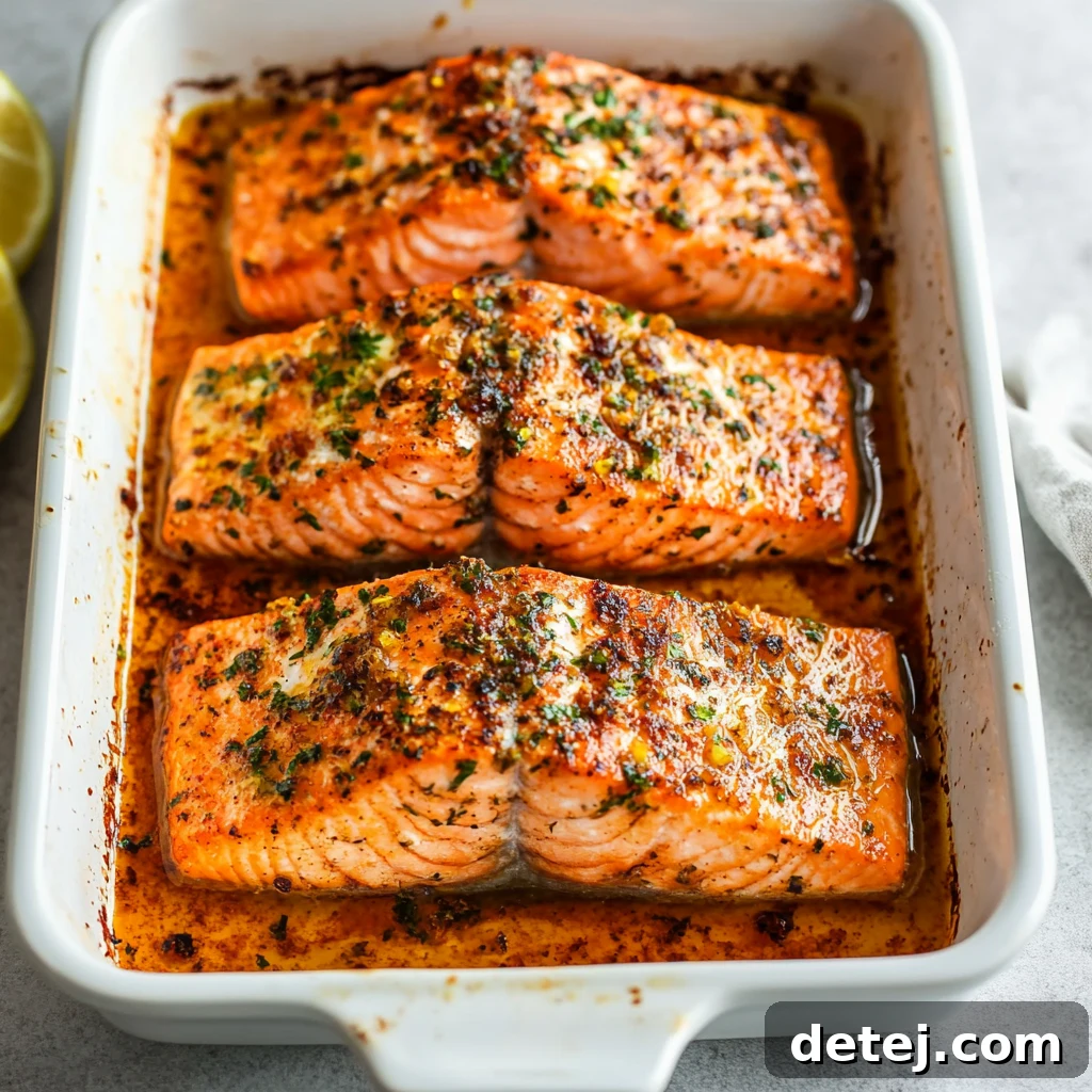 Freshly baked salmon fillets topped with the vibrant avocado and Cotija mixture, ready to serve.