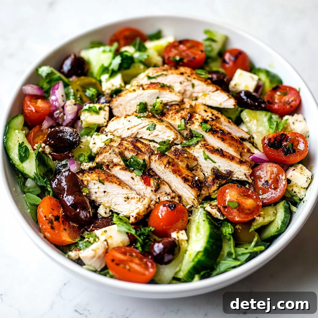 Deliciously Healthy Greek Chicken Salad with grilled chicken, feta, olives, and fresh vegetables