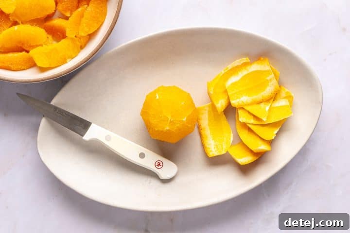 slicing orange segments.