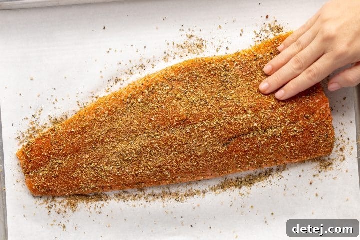 rub the spice in the salmon. 