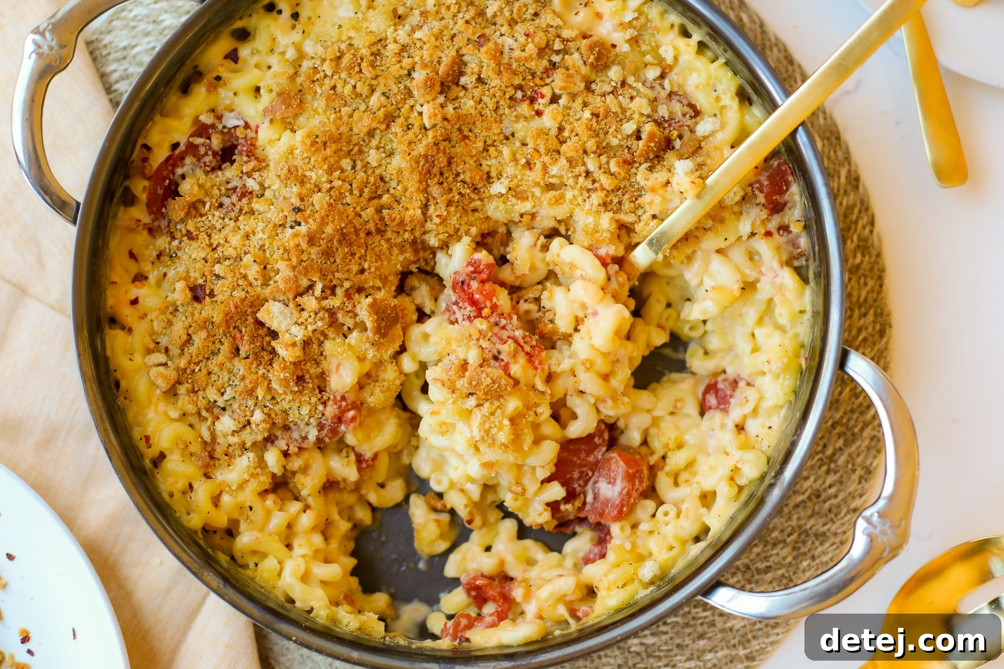 Close-up of the rich, creamy texture of Baked Macaroni and Cheese with Roasted Tomatoes.