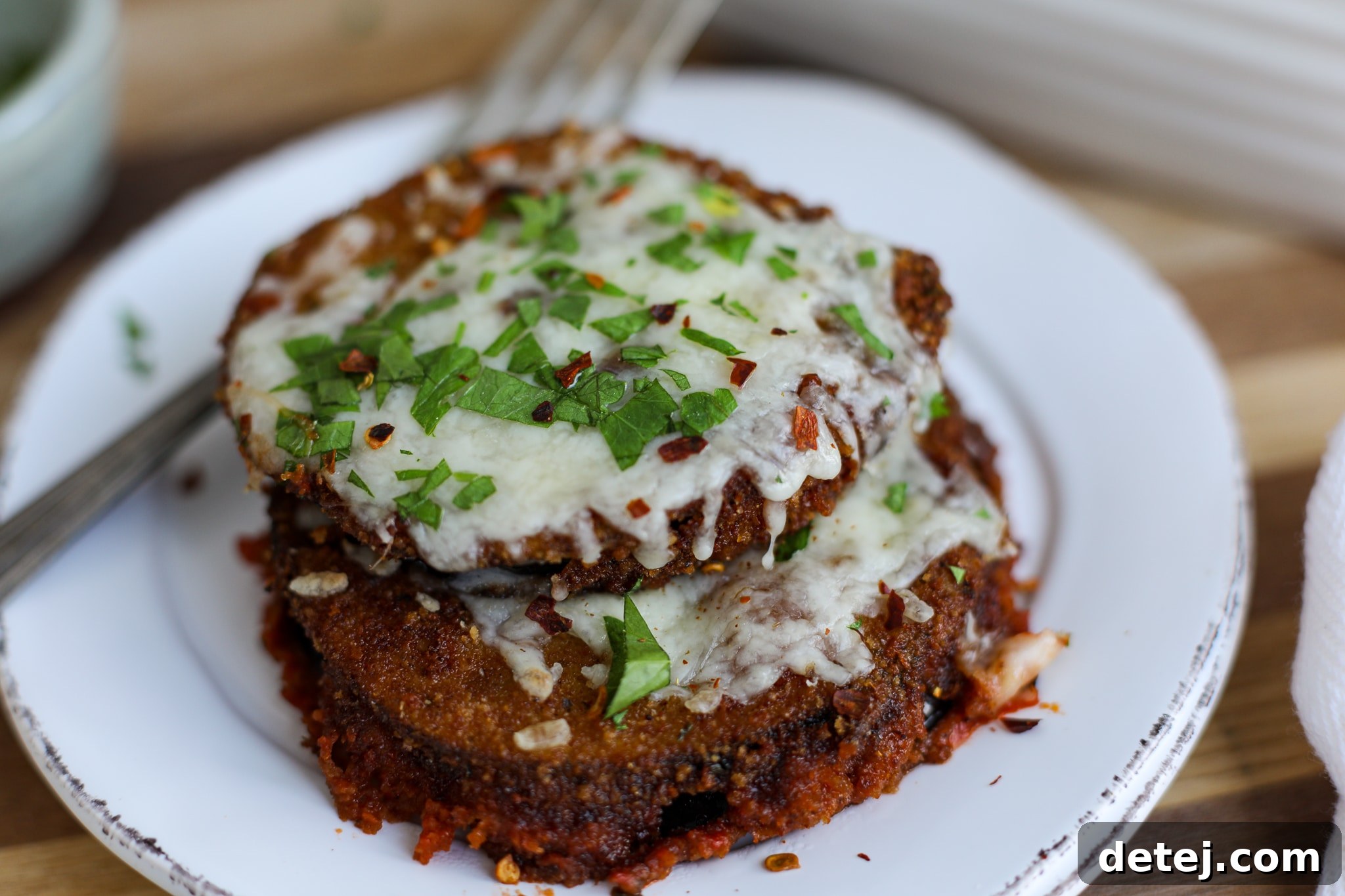 Baked Easy Eggplant Parmesan with melted cheese and sauce.