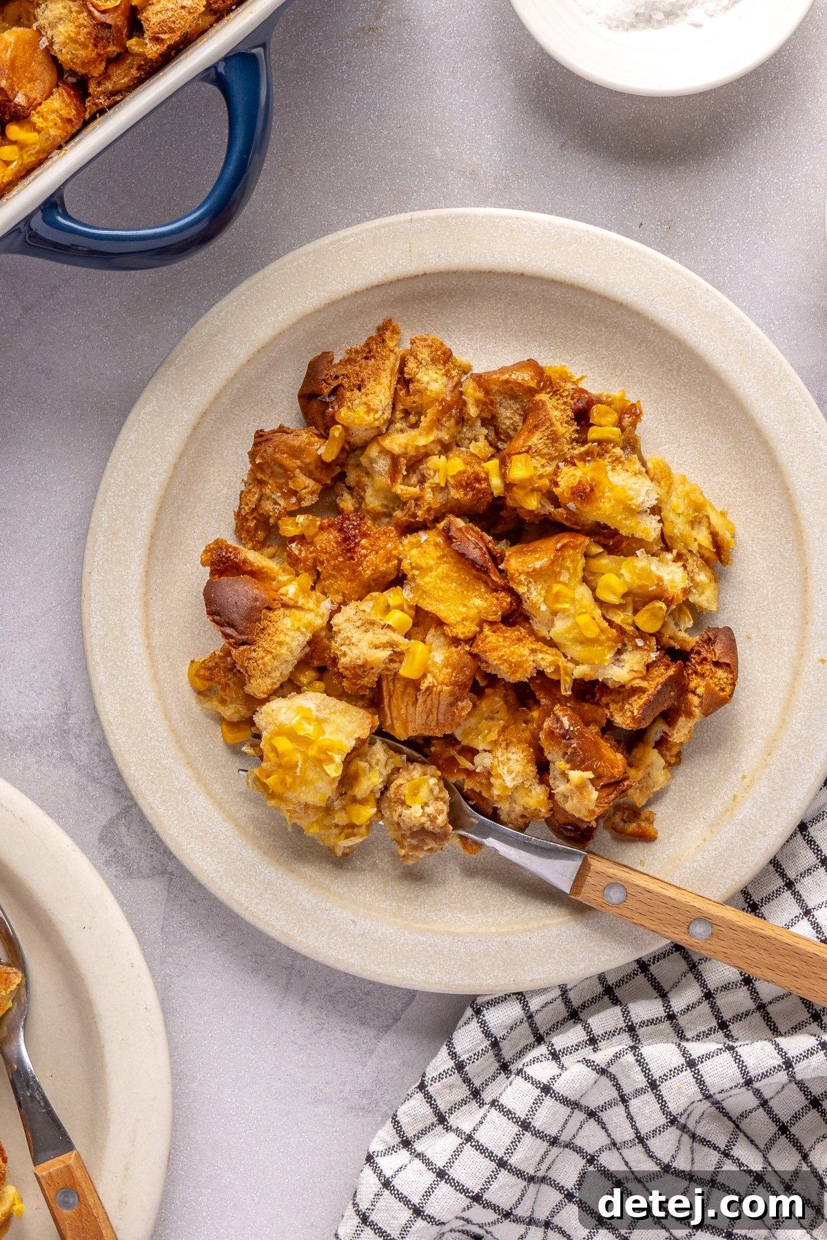 cornbread pudding on a plate.