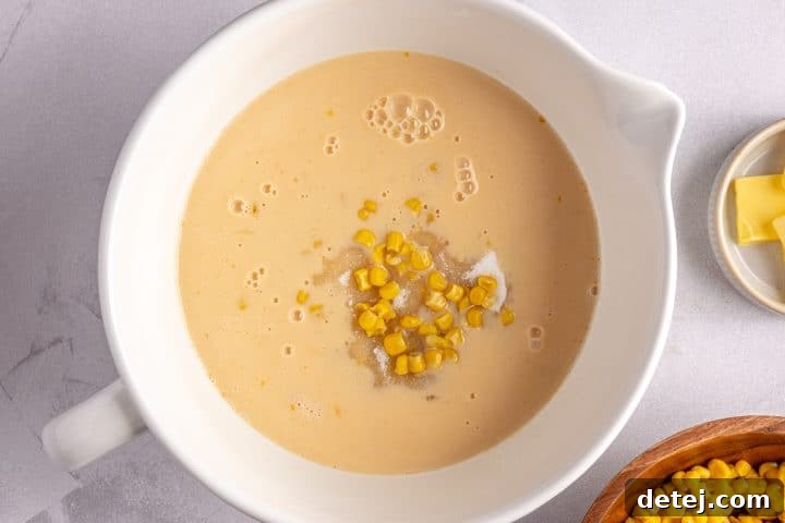 corn, milk, egg and sugar in a bowl. 