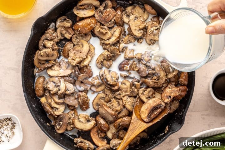 adding milk to mushrooms. 