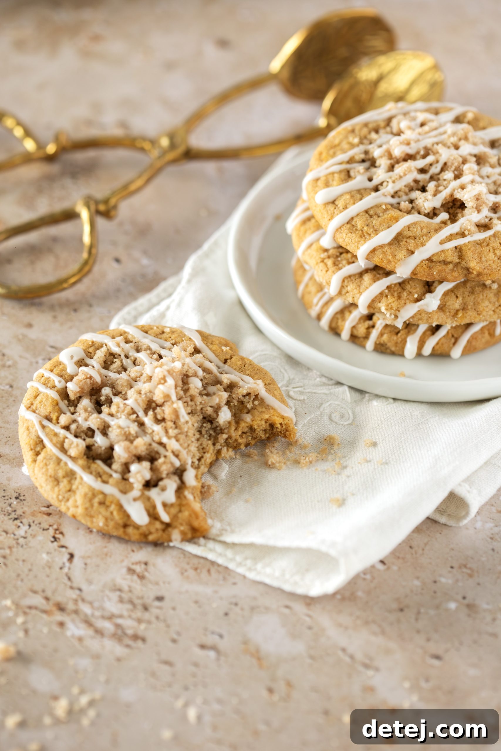 Stack of pumpkin streusel crumble cookies with maple glaze