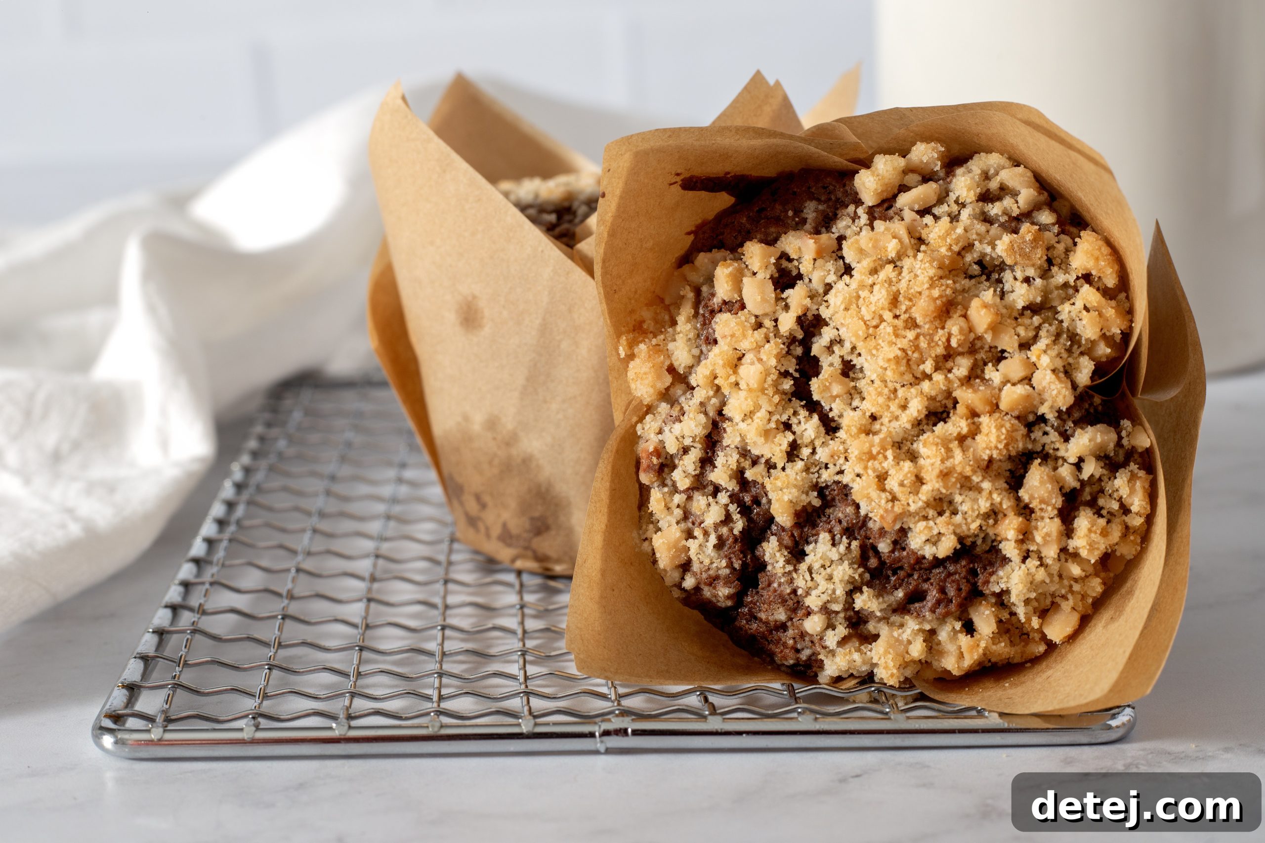 Crumbly streusel topping, a mix of flour, sugar, butter, and toffee bits, prepared in a bowl.
