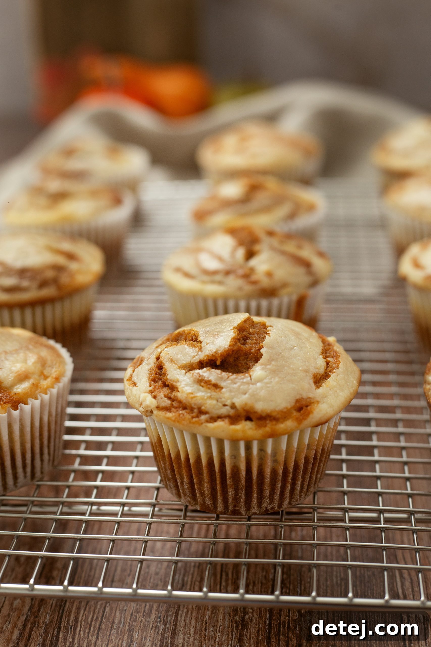 A bowl of creamy cheesecake filling, ready to be swirled into pumpkin muffin batter.