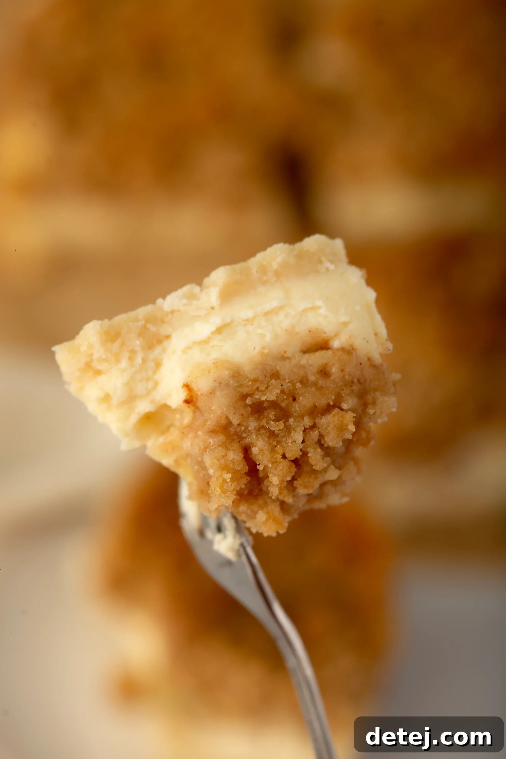 Close-up of streusel topping mixture in a small bowl, showcasing its crumbly, damp sand-like texture.