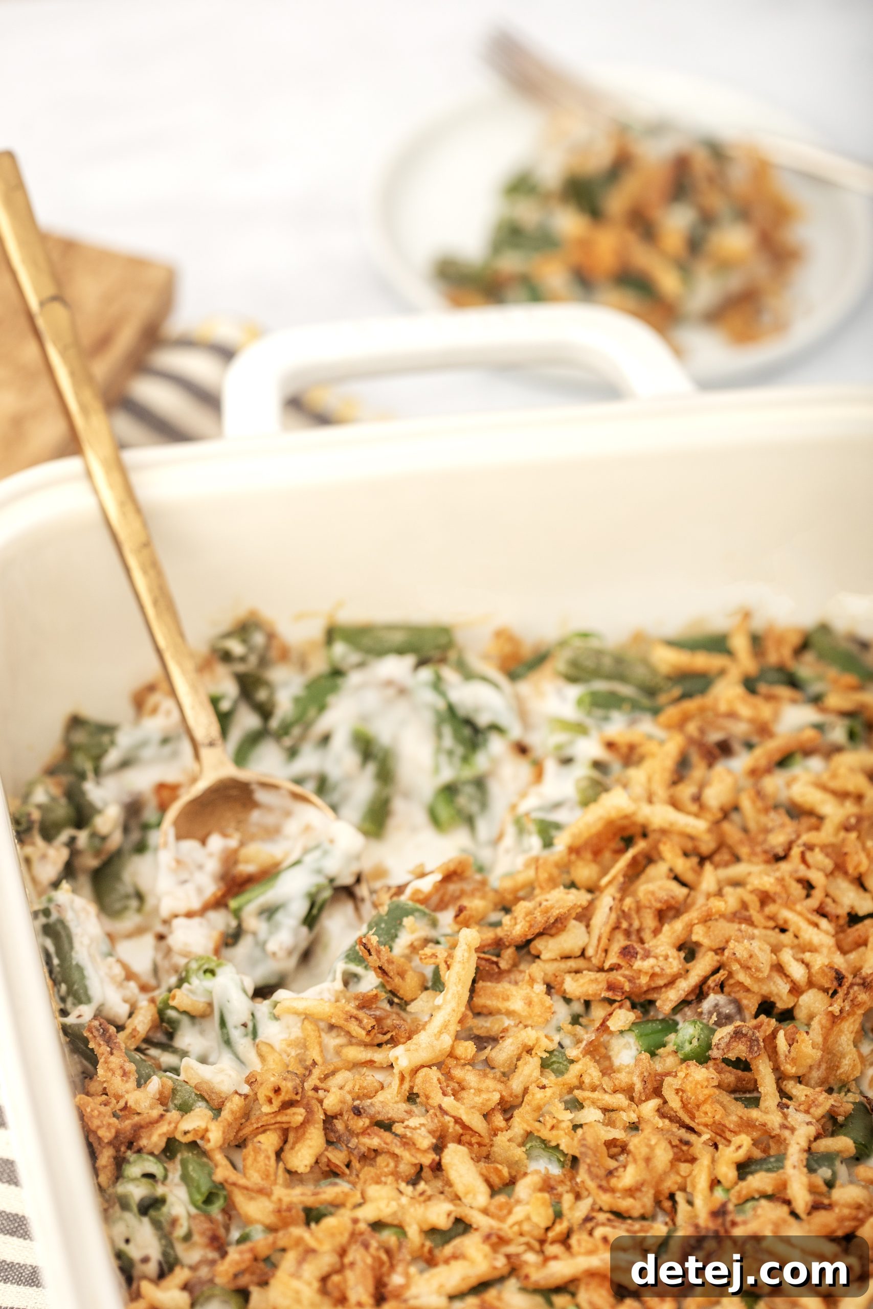 A close-up of green bean casserole, showing texture and detail, possibly with a slight customization.