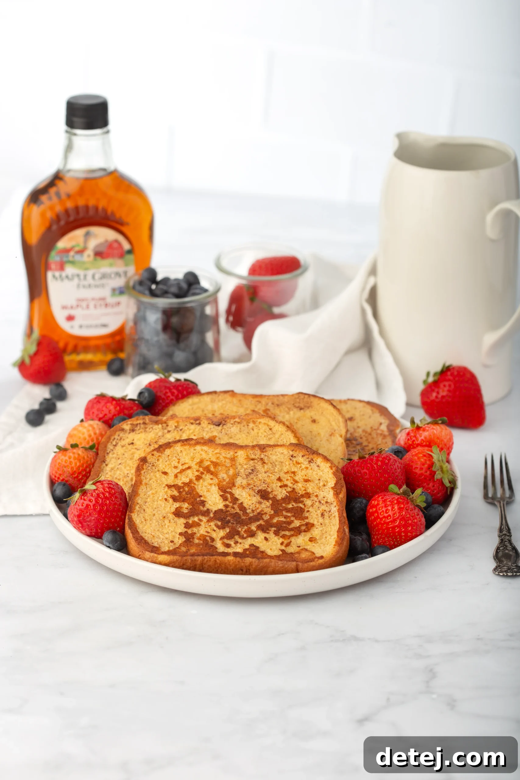 Close-up of French Toast ingredients including bread, eggs, milk, and cinnamon.