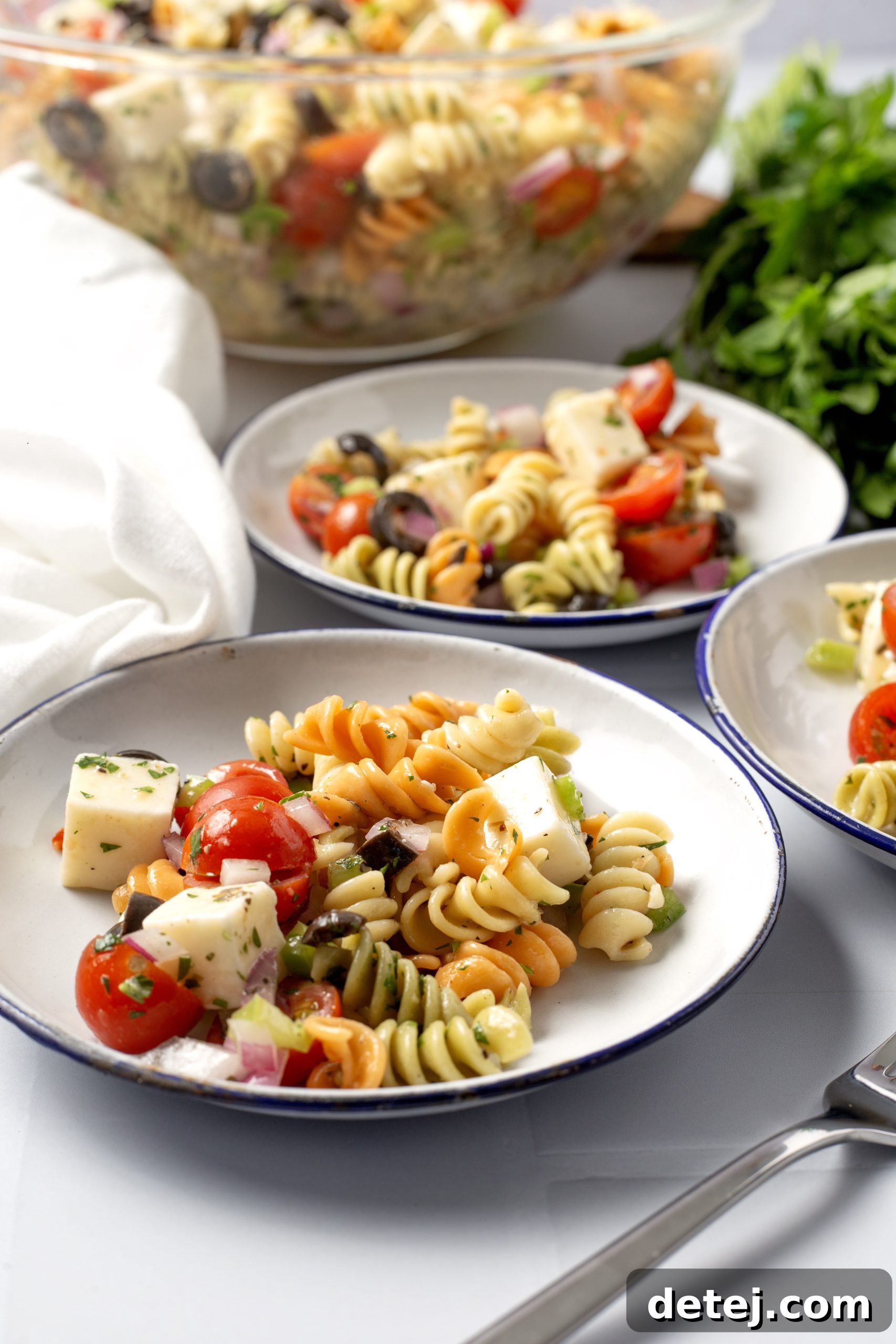 Vibrant Italian Pasta Salad 6 A large bowl of vibrant Italian pasta salad, ready to be served at a gathering.