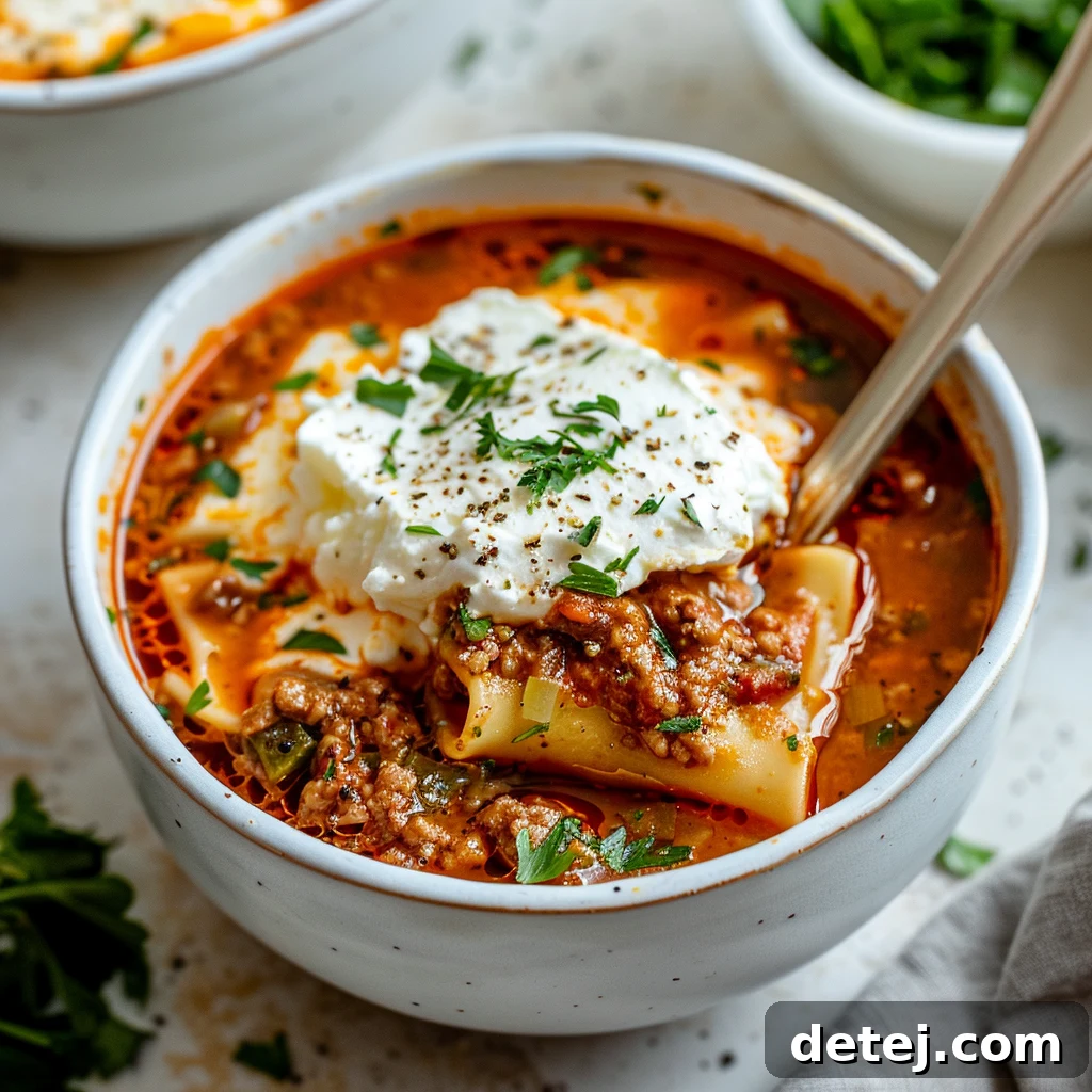 Close-up of Lasagna Soup with melted cheese and noodles, ready to be served.
