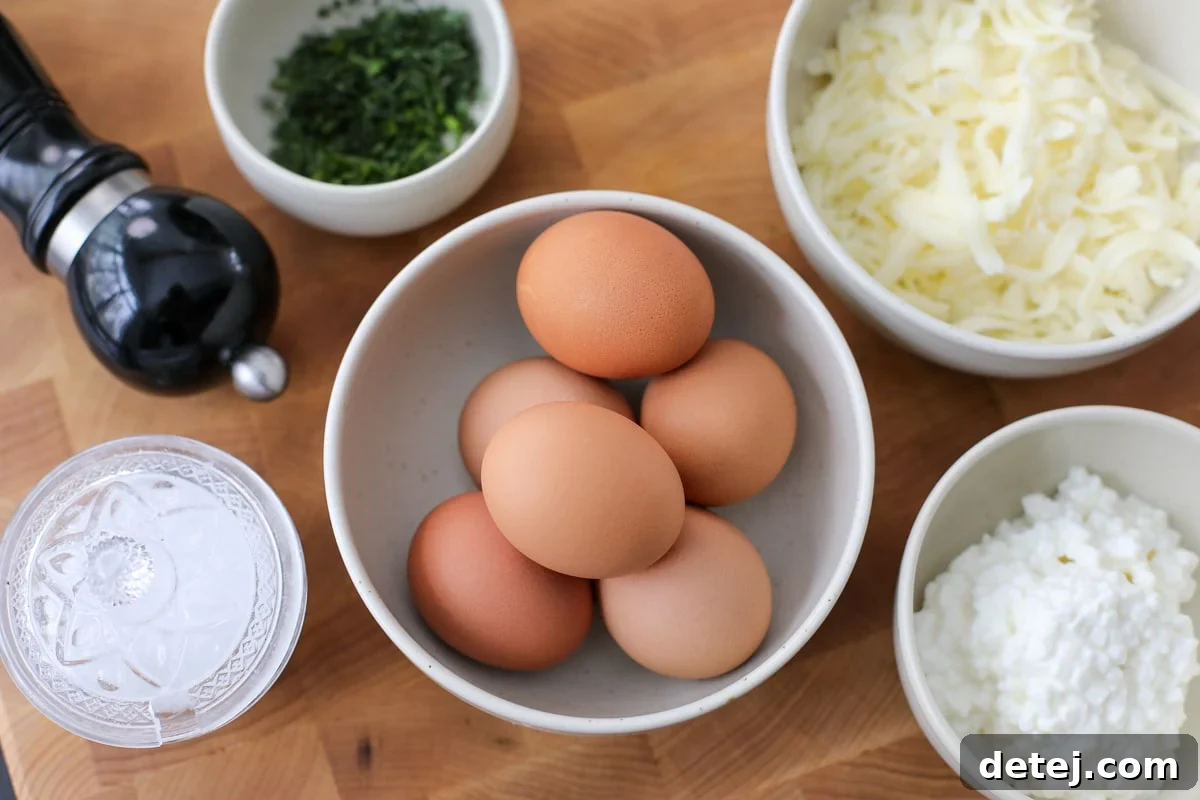 Ingredients needed for Easy Cheesy Egg Bites including eggs, cheese, and fresh herbs.