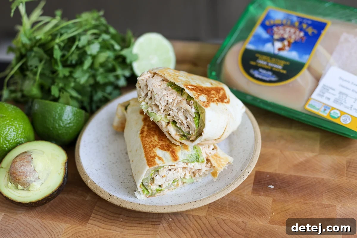 A freshly made Chicken Power Wrap next to Smart Chicken packaging, highlighting premium ingredients.