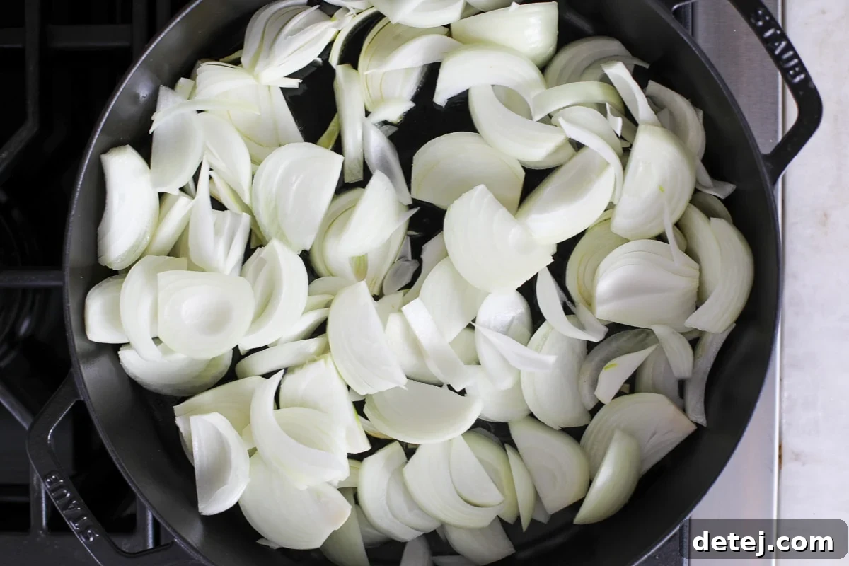 raw onions in a pan before cooking