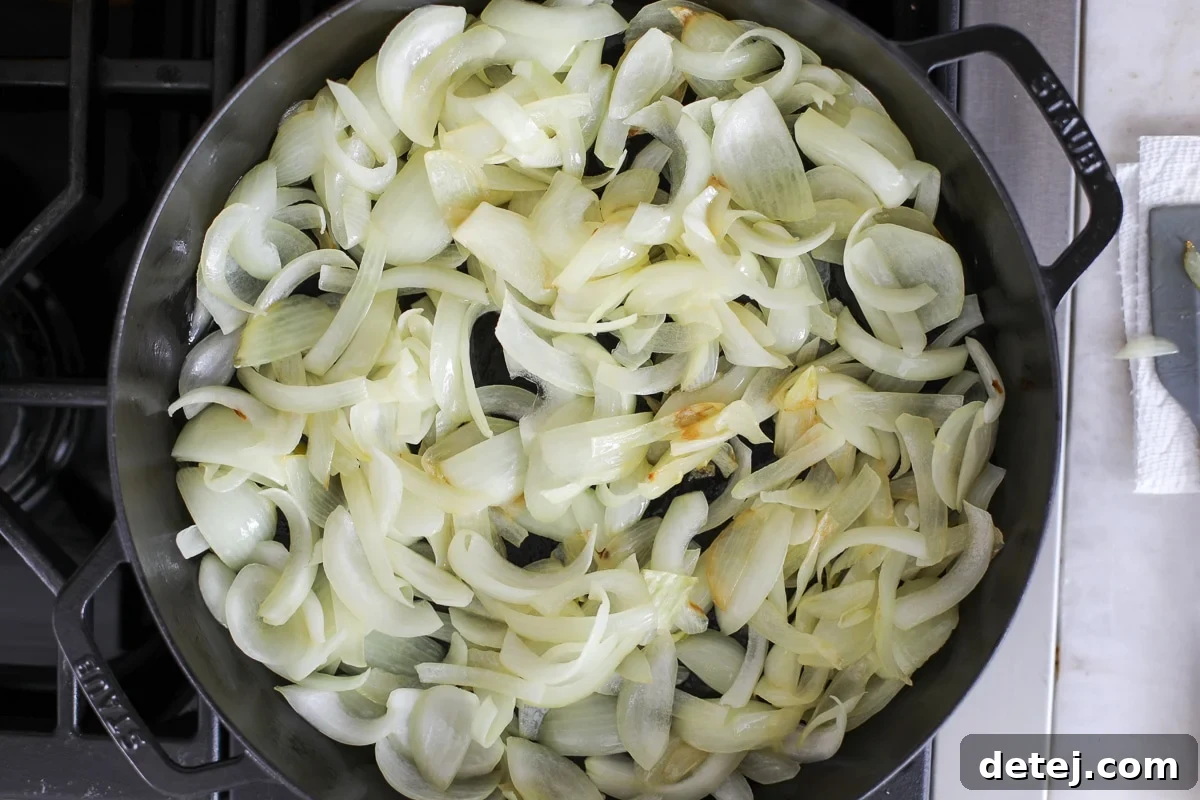 onions softening in a pan