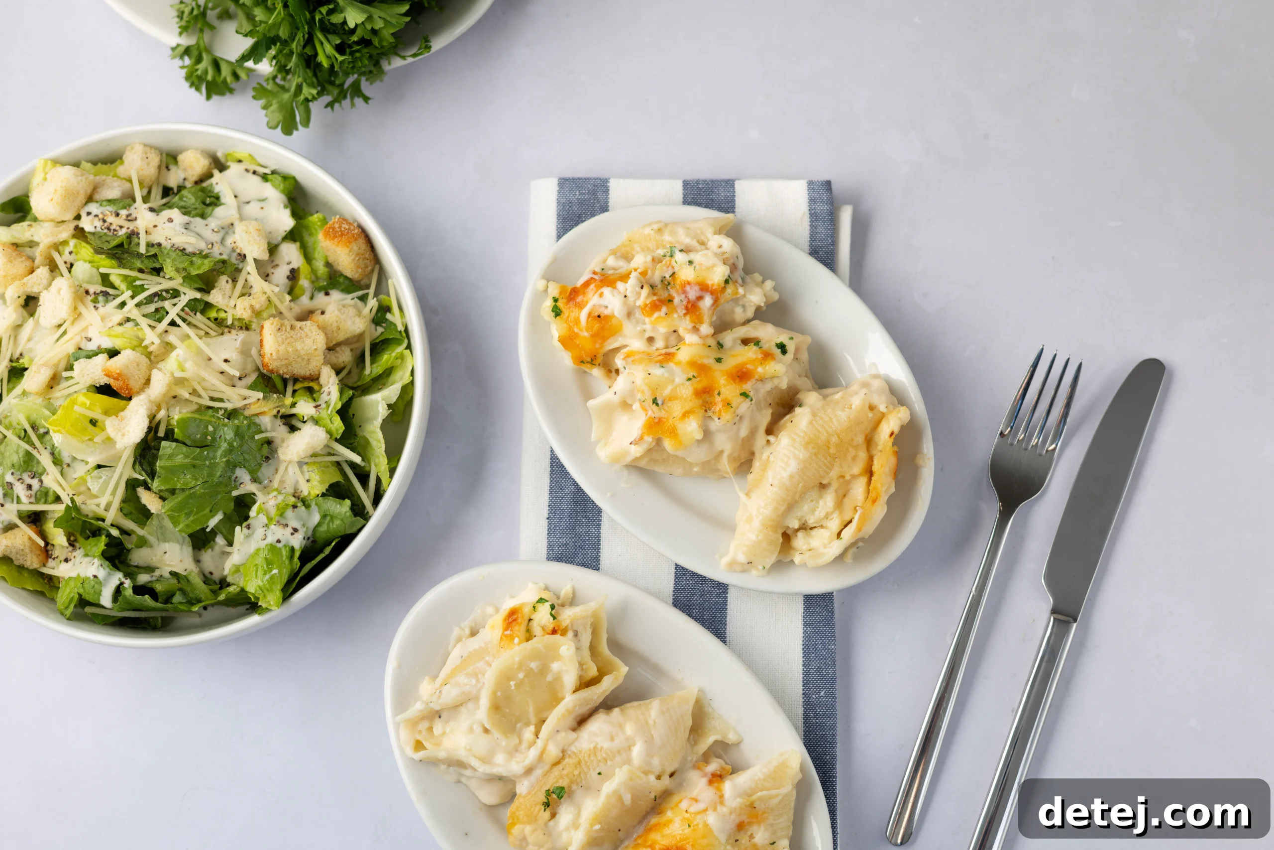 Close-up of baked Chicken Alfredo Stuffed Shells with melted cheese