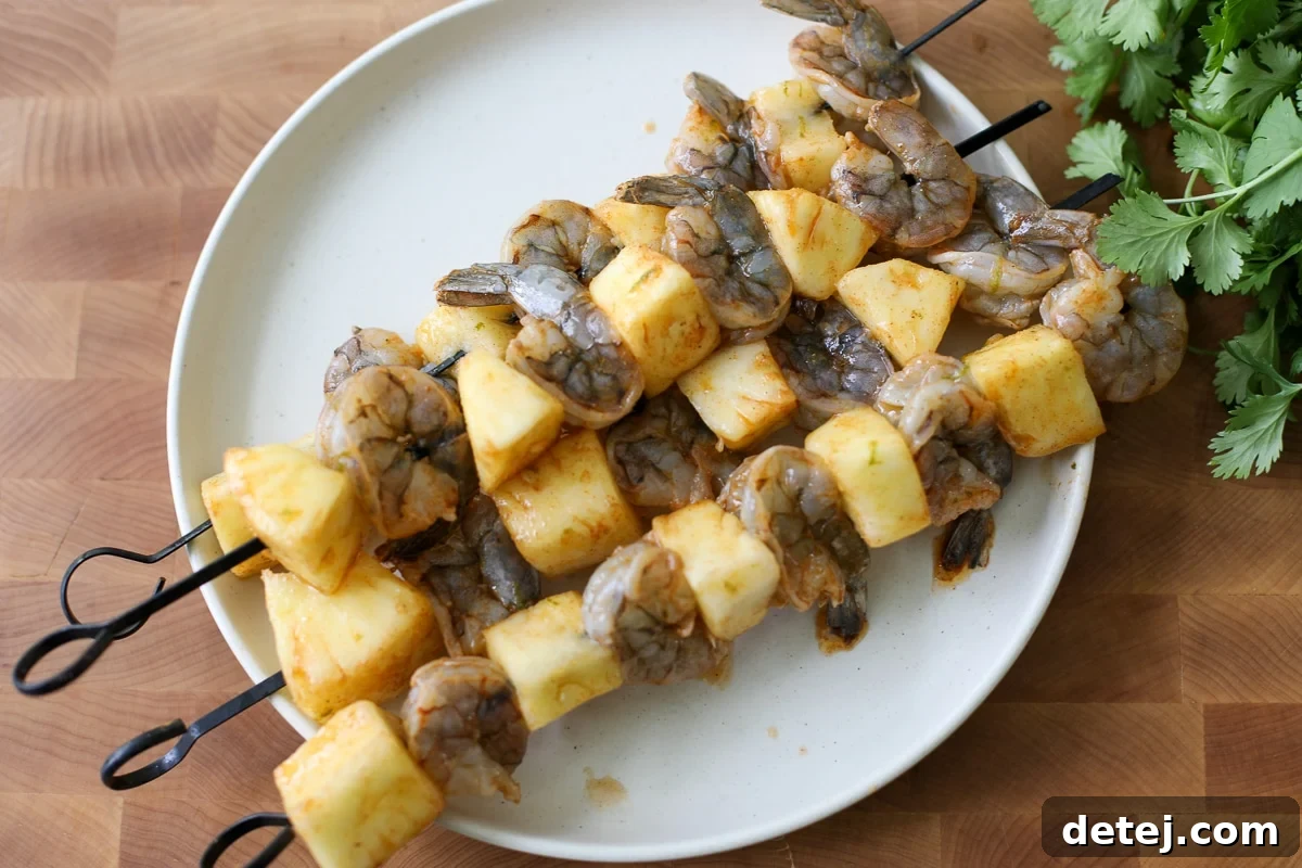 shrimp and pineapple on a skewer.