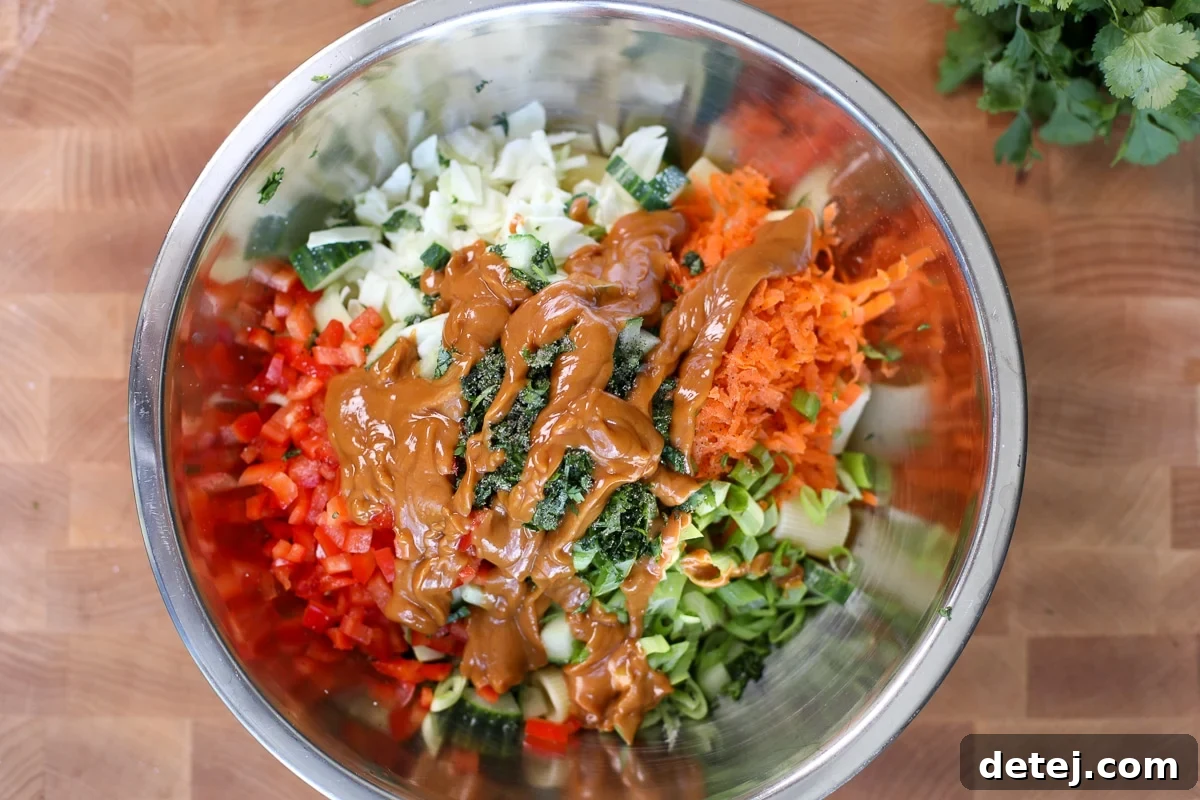Crispy Chicken Cutlet Pasta Salad with Creamy Lemon Dressing 5 vegetables in a bowl with peanut sauce.