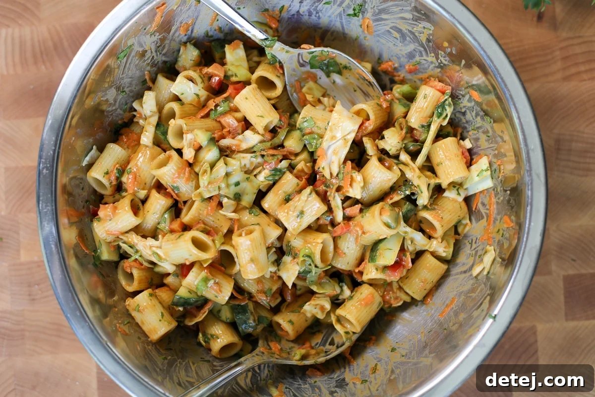 Crispy Chicken Cutlet Pasta Salad with Creamy Lemon Dressing 6 tossed salad in a bowl with peanut sauce.