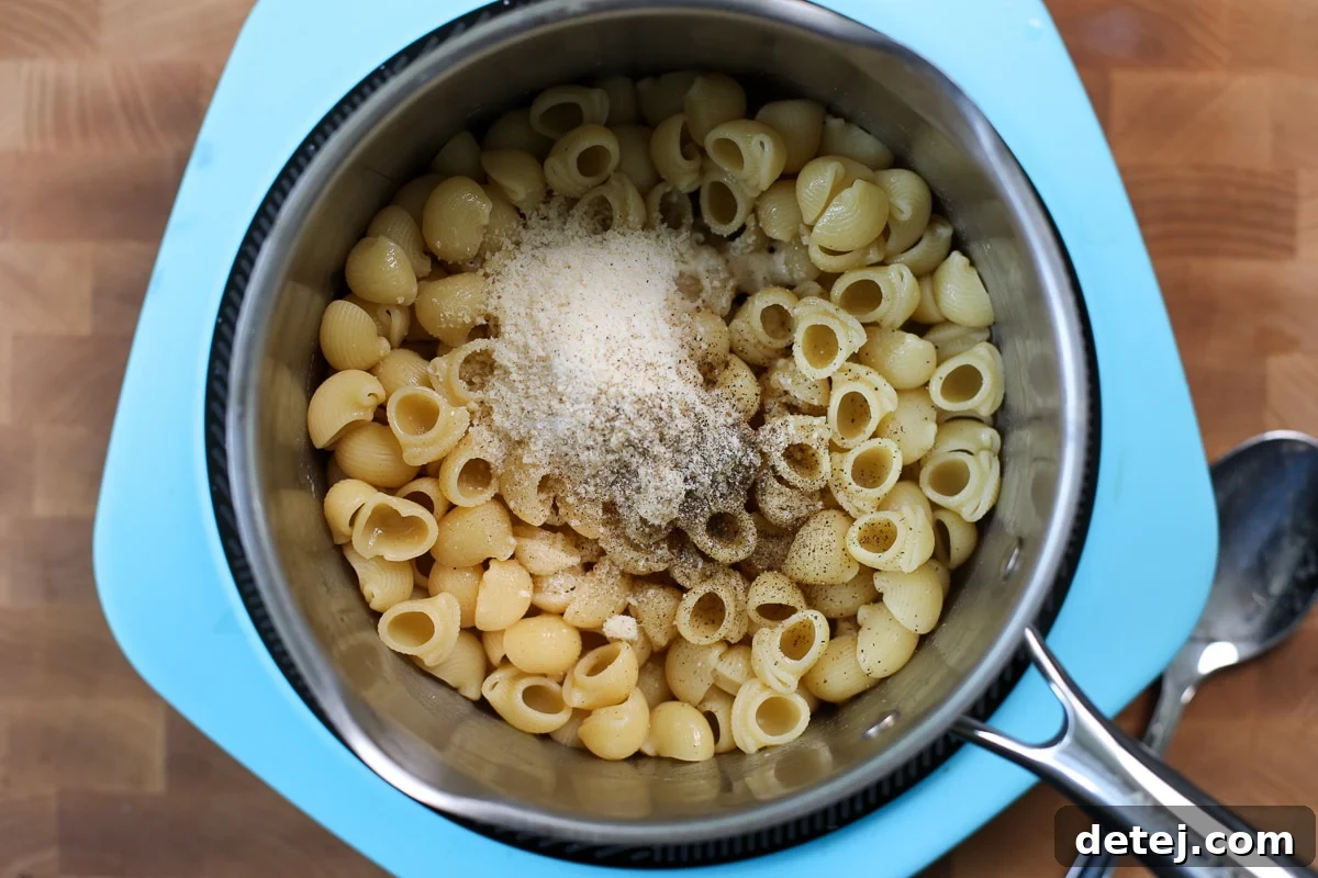 Bone Broth Pasta Recipe with Garlic, Herbs, and Parmesan 7 cheese and pepper in pasta.